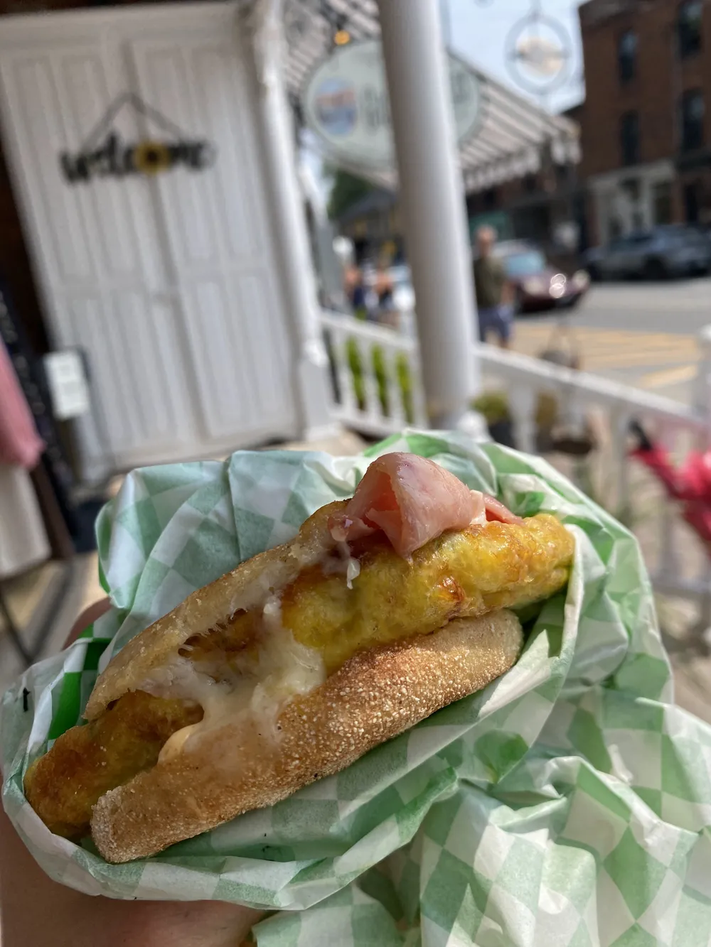 A breakfast sandwich on the front porch